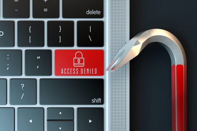 Computer keyboard and a crowbar Cyber crime concept Computer keyboard Cyber attack