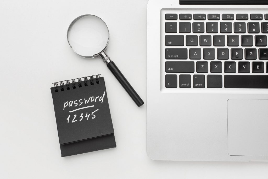 strong password, computer keyboard with magnifying glass and notes, computer keyboard with password