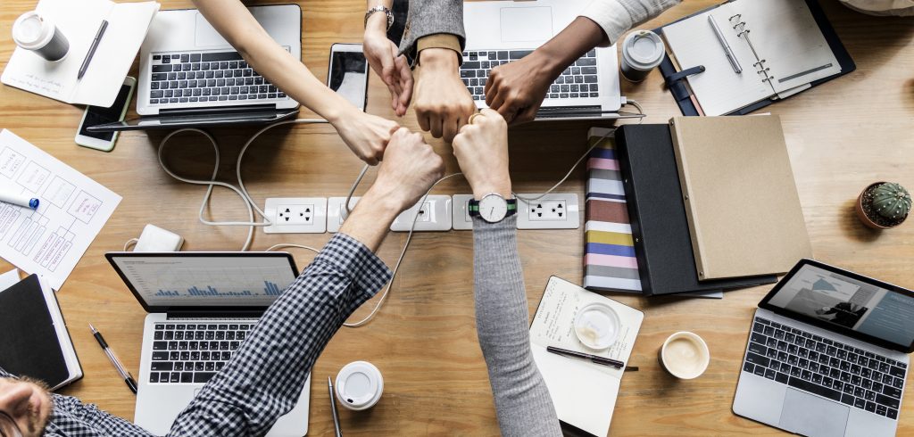 Colleagues giving a fist bump Teamwork