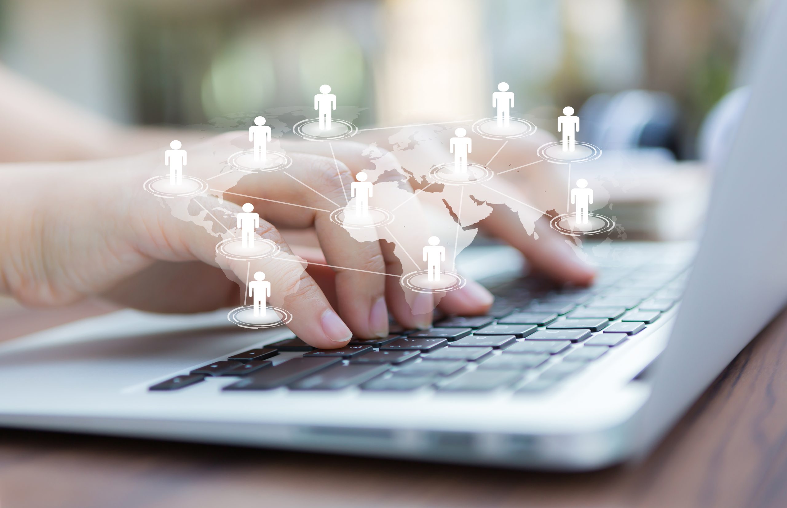 Closeup of business woman hand typing on laptop keyboard